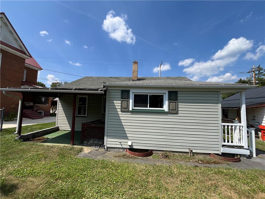 708 Nichols Street Clearfield, PA 16830 - Photo 3 of 12 a front view of a house with garden