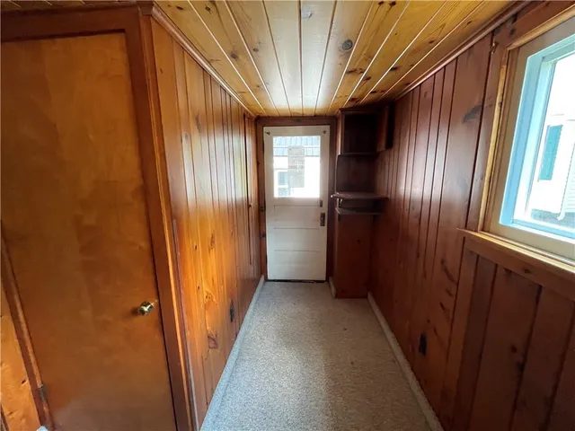 a view of hallway with windows