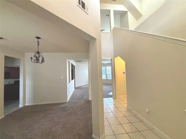 a view of a room with a chandelier