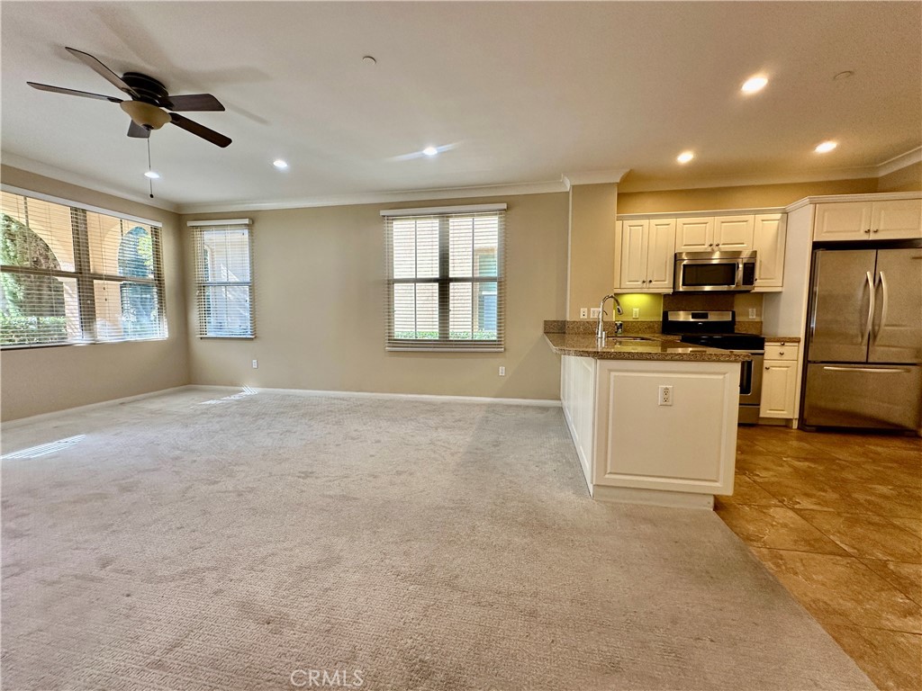 18 Serenity Irvine, CA 92618 - Photo 3 of 14 a view of a kitchen with a sink cabinets and stainless steel appliances