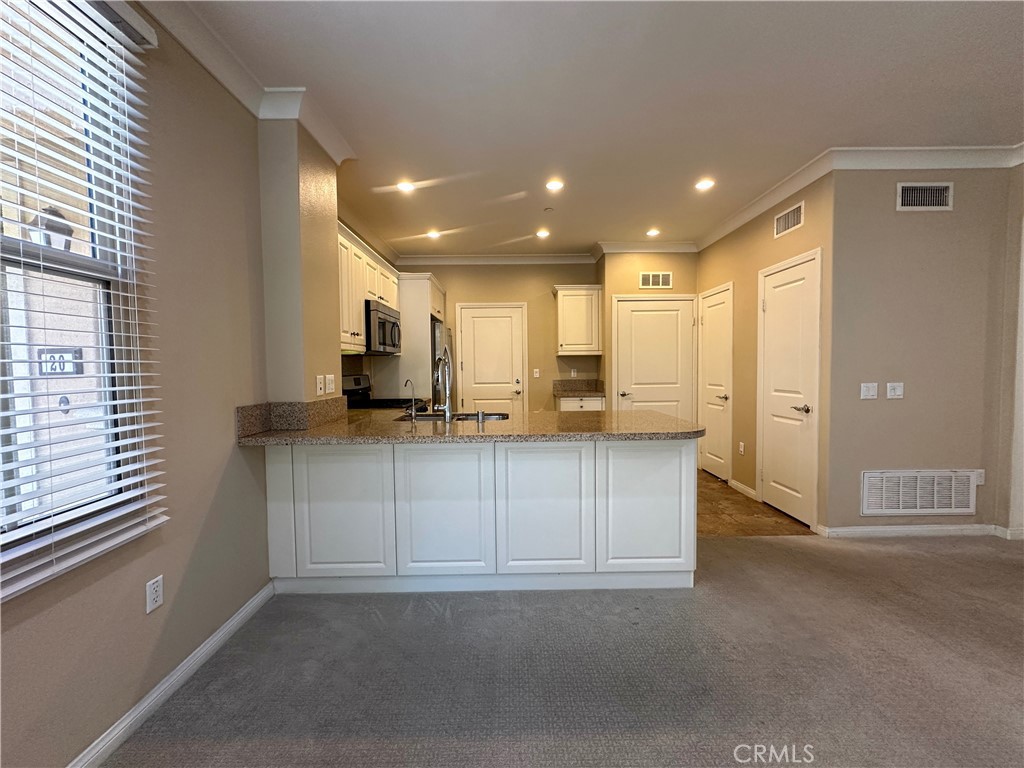 18 Serenity Irvine, CA 92618 - Photo 6 of 14 a view of kitchen with stainless steel appliances cabinets