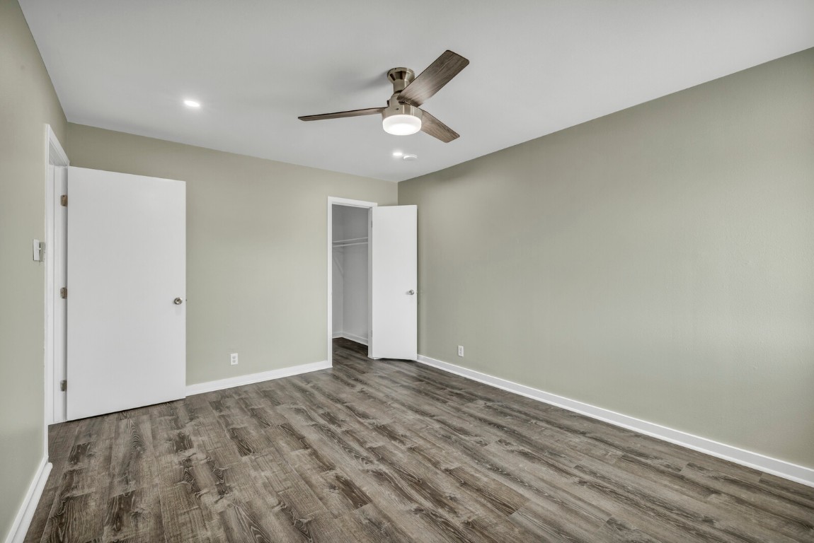 2808 Skyway Circle, Unit 101 Austin, TX 78704 - Photo 18 of 25 a view of an empty room with wooden floor and ceiling fan