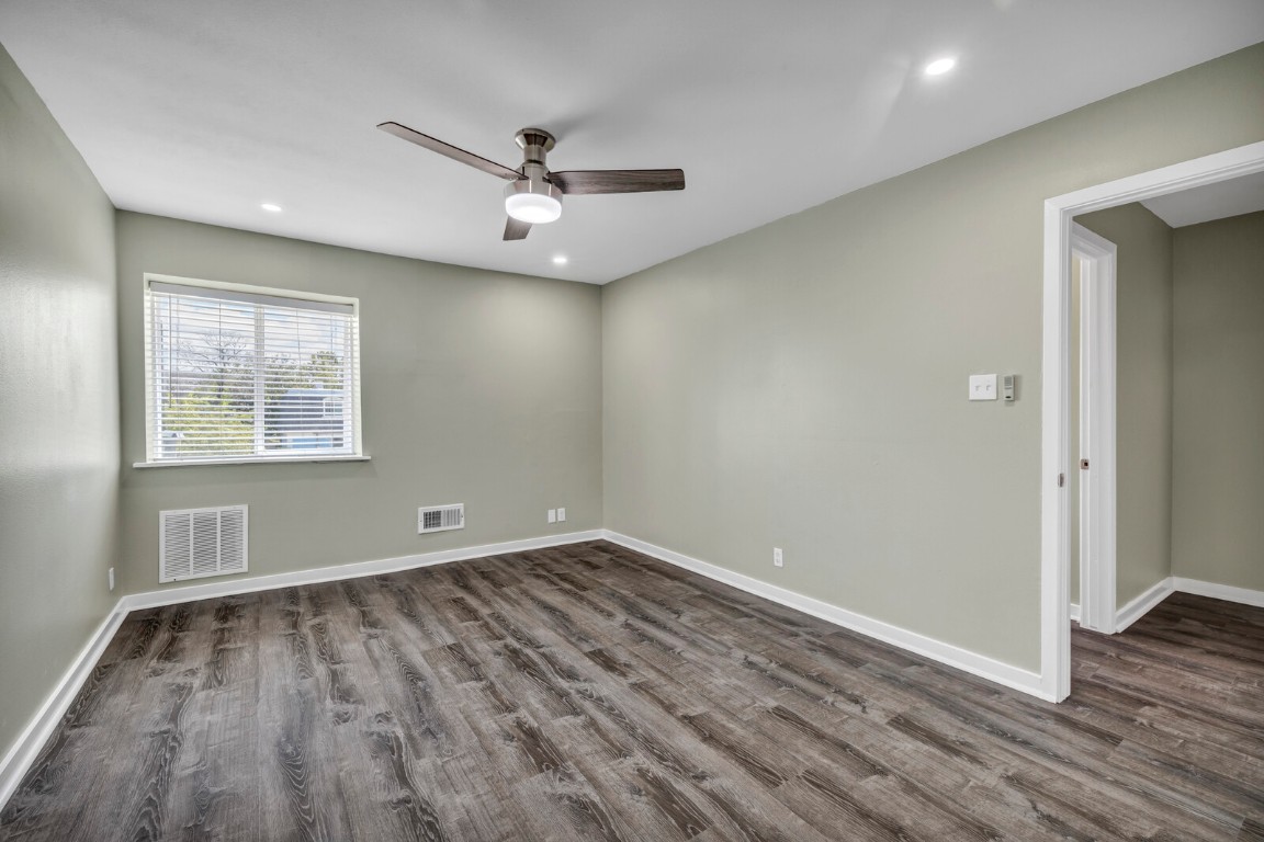 2808 Skyway Circle, Unit 101 Austin, TX 78704 - Photo 19 of 25 wooden floor in an empty room with a window