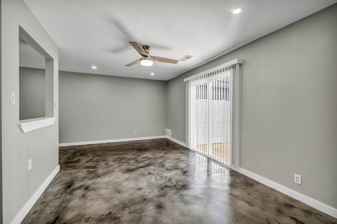 2808 Skyway Circle, Unit 101 Austin, TX 78704 - Photo 7 of 25 an empty room with wooden floor and windows