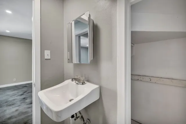 a bathroom with a sink and a mirror