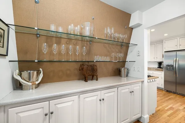 a kitchen with a refrigerator and a sink