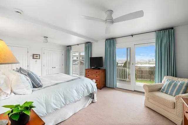 a spacious bedroom with a bed and a couch