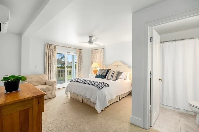 a spacious bedroom with a bed and a couch