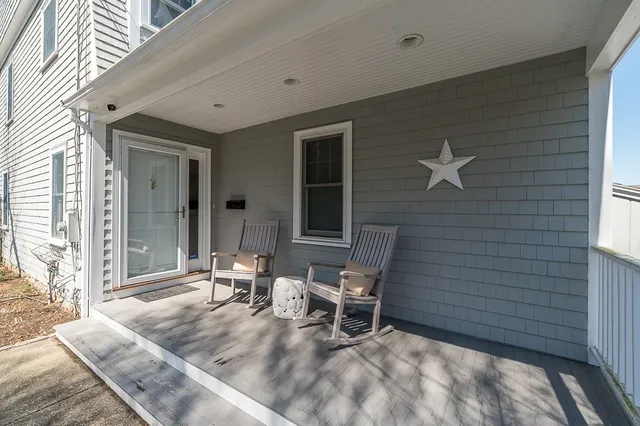 a backyard of a house with outdoor seating