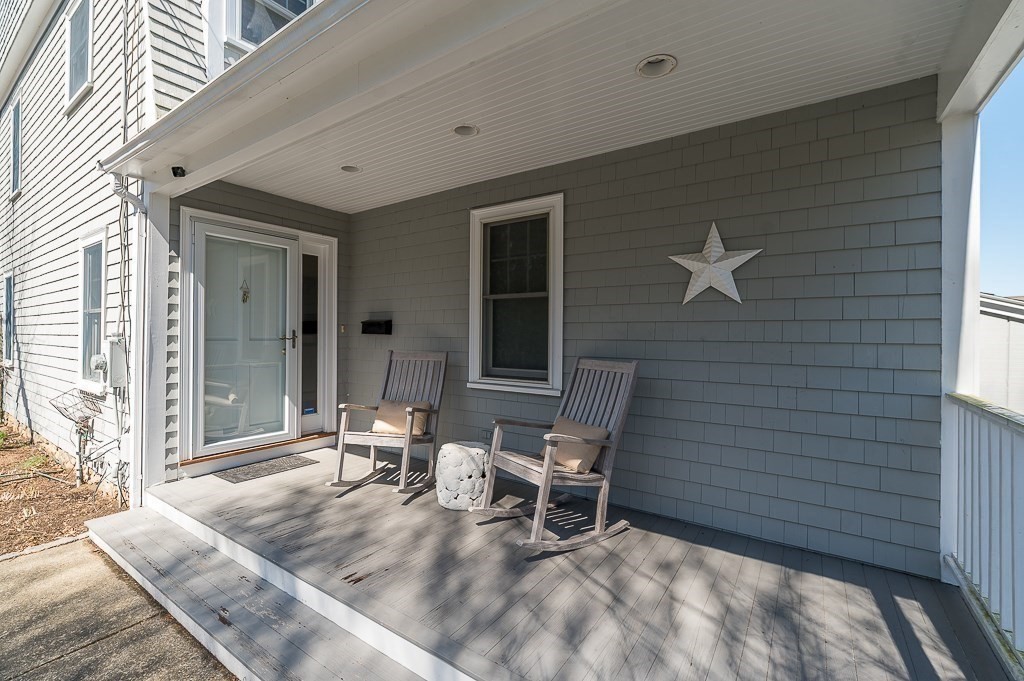 7 Hawthorne Lane Gloucester, MA 01930 - Photo 4 of 24 a backyard of a house with outdoor seating