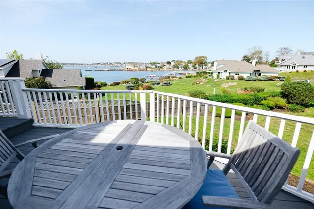 a view of a balcony with wooden floor