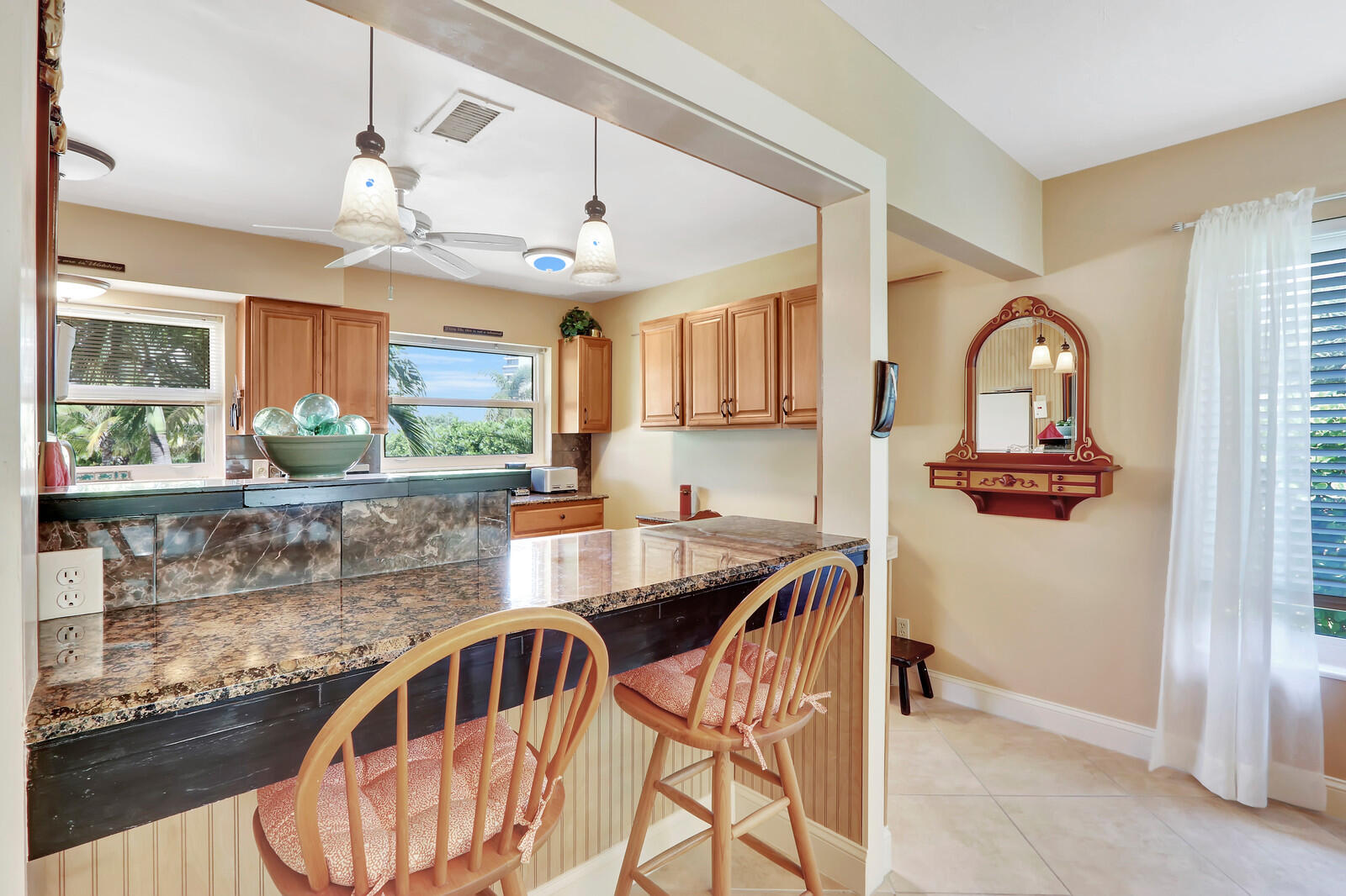 390 North Juno Lane Juno Beach, FL 33408 - Photo 21 of 33 a kitchen with stainless steel appliances granite countertop a sink and a refrigerator