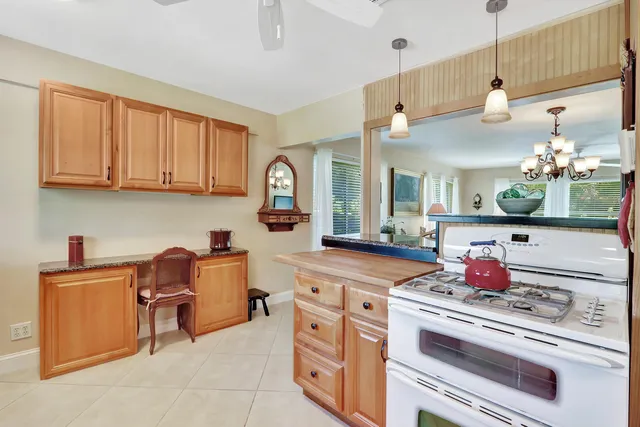 a kitchen with cabinets and appliances