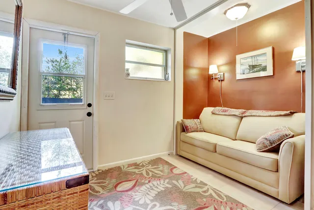a living room with furniture and a rug