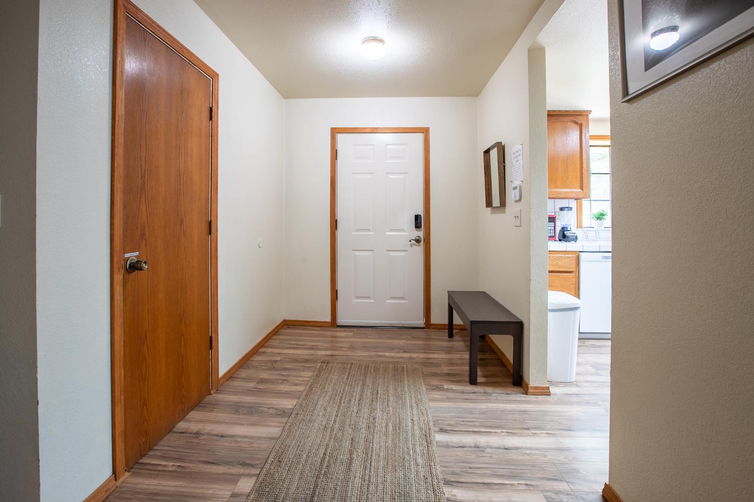52865 Highway 245 Miramonte, CA 93641 - Photo 16 of 50 a view of a hallway with wooden floor and staircase