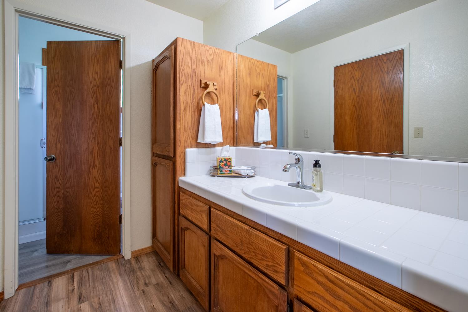 52865 Highway 245 Miramonte, CA 93641 - Photo 19 of 50 a bathroom with double vanity and a mirror