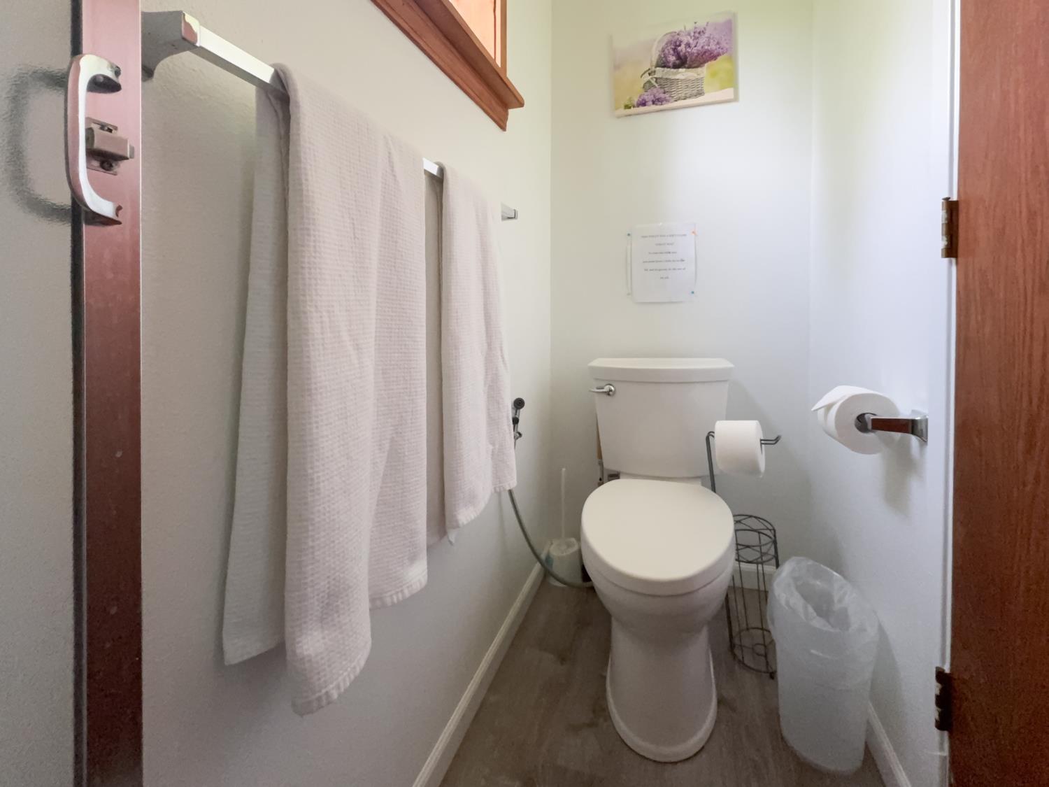 52865 Highway 245 Miramonte, CA 93641 - Photo 20 of 50 a white toilet sitting next to a bathroom sink