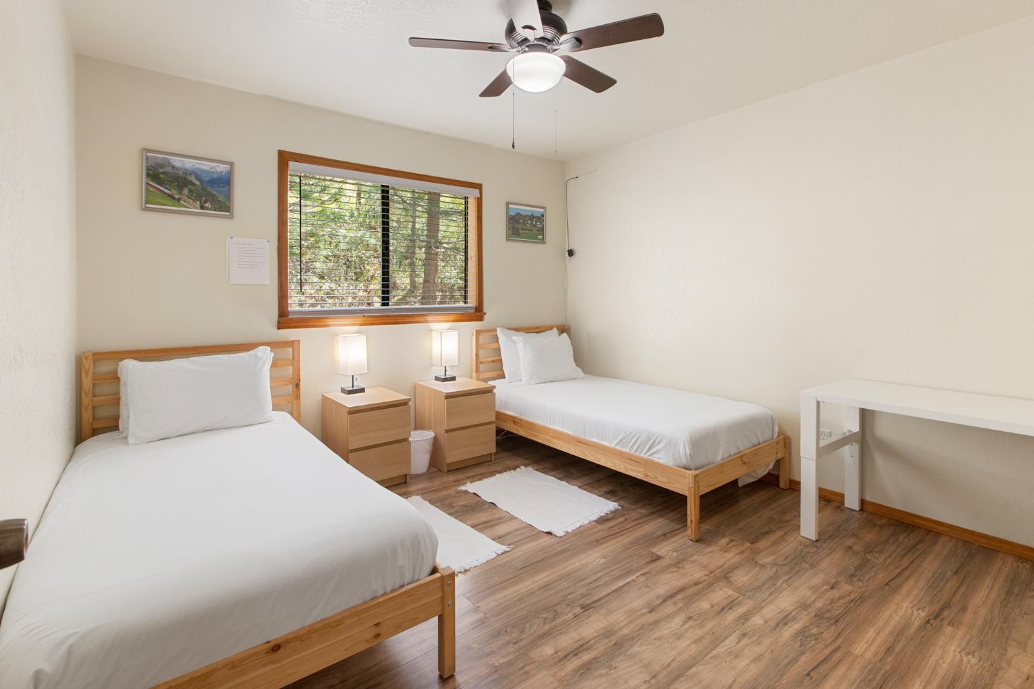 52865 Highway 245 Miramonte, CA 93641 - Photo 24 of 50 a bedroom with a bed and window