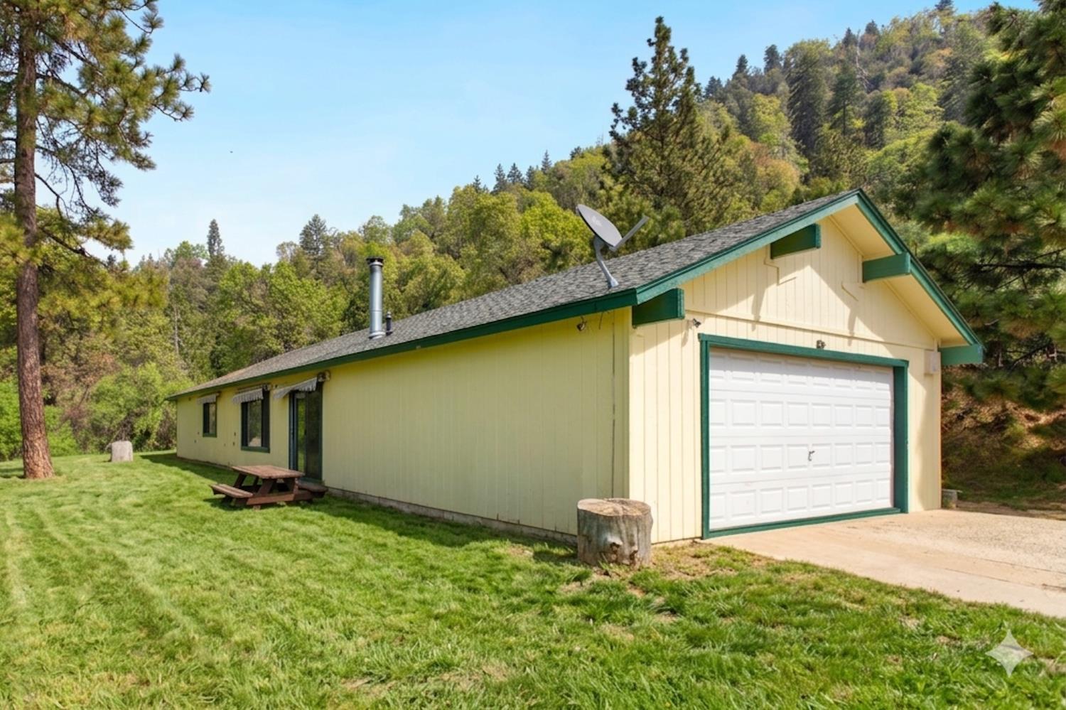52865 Highway 245 Miramonte, CA 93641 - Photo 37 of 50 a backyard of a house with lots of green space