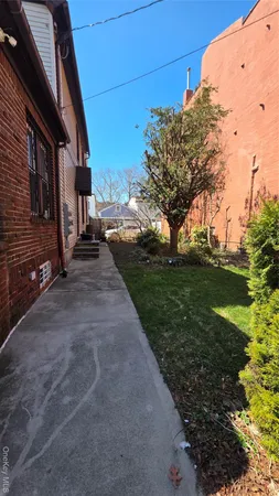a view of a backyard of the house