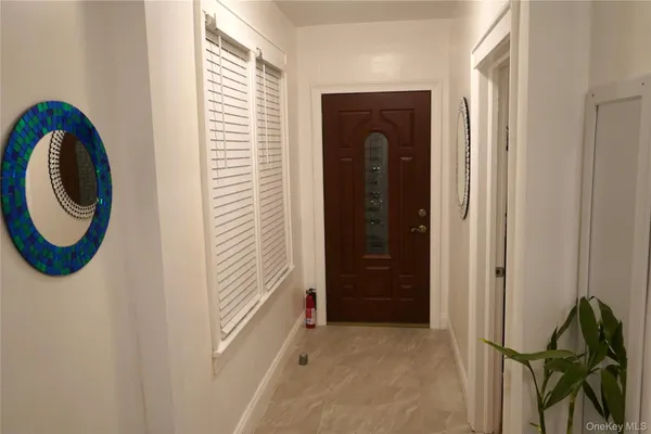 a view of a hallway with washer and dryer