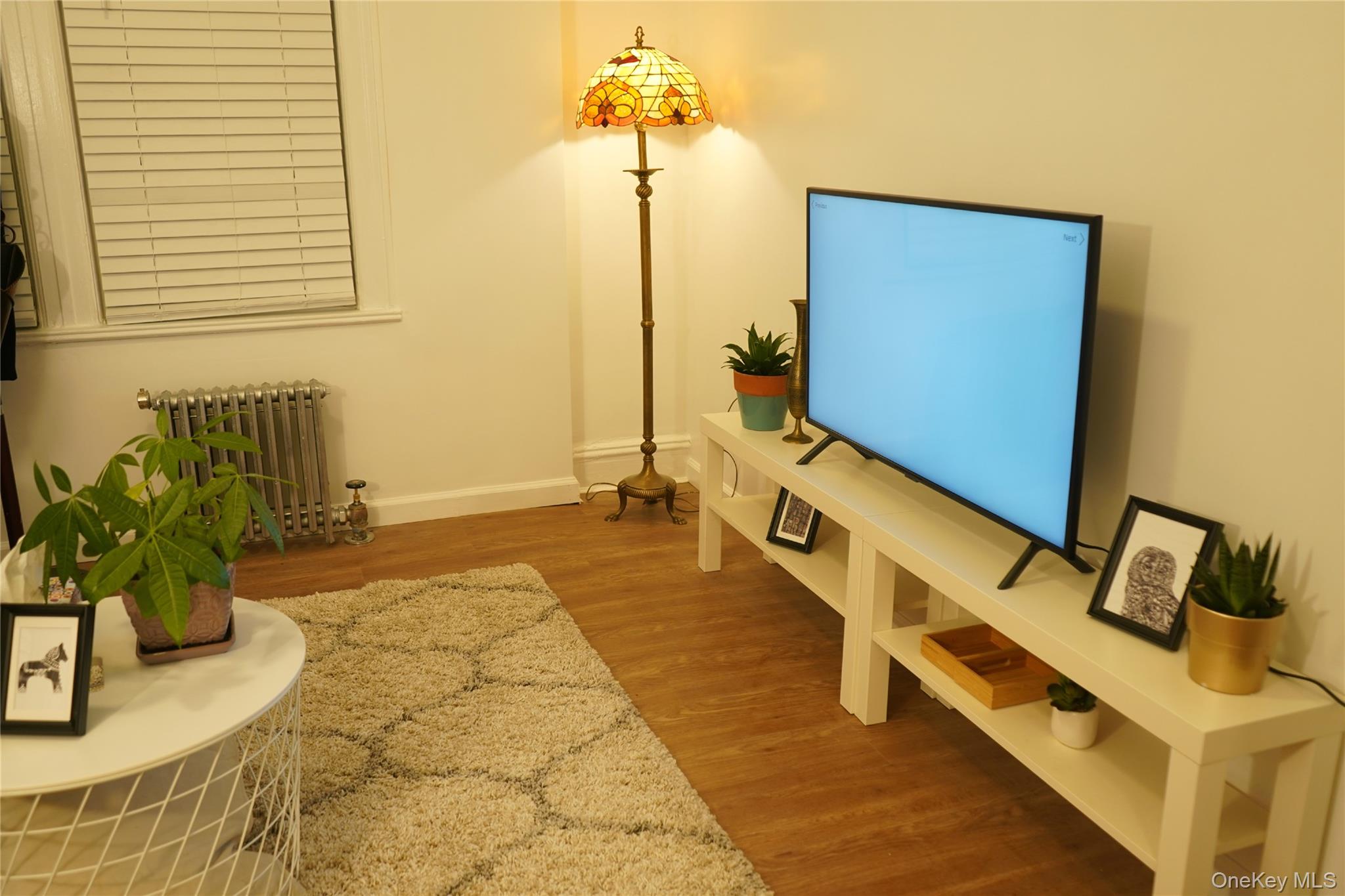 37-54 99th Street Queens, NY 11368 - Photo 7 of 18 a bathroom with a tub sink and mirror