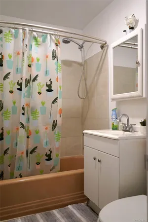 a bathroom with a sink a bathtub and a shower