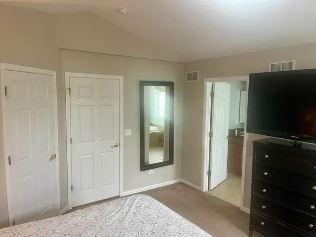 a view of a livingroom with wooden floor and closet