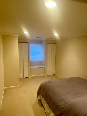 a view of a room with a bed