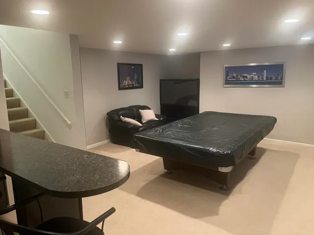 a living room with a couch and a flat screen tv