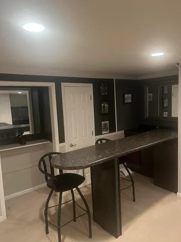 a view of a kitchen area with furniture and window