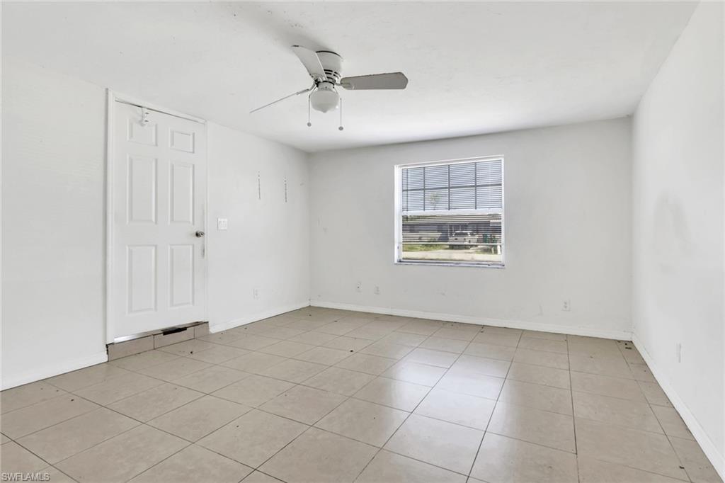 5326 Dixie Drive Naples, FL 34113 - Photo 12 of 25 a view of an empty room with a window