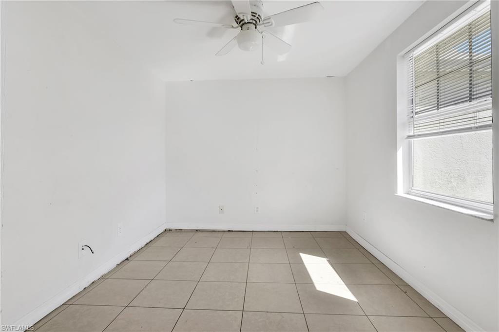 5326 Dixie Drive Naples, FL 34113 - Photo 14 of 25 an empty room with a window