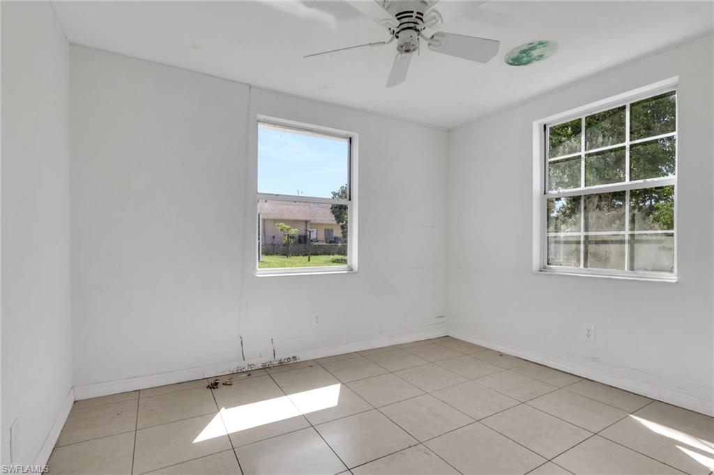 5326 Dixie Drive Naples, FL 34113 - Photo 18 of 25 an empty room with windows