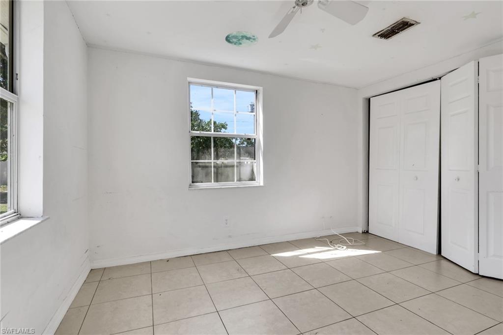 5326 Dixie Drive Naples, FL 34113 - Photo 19 of 25 a view of an empty room with a window