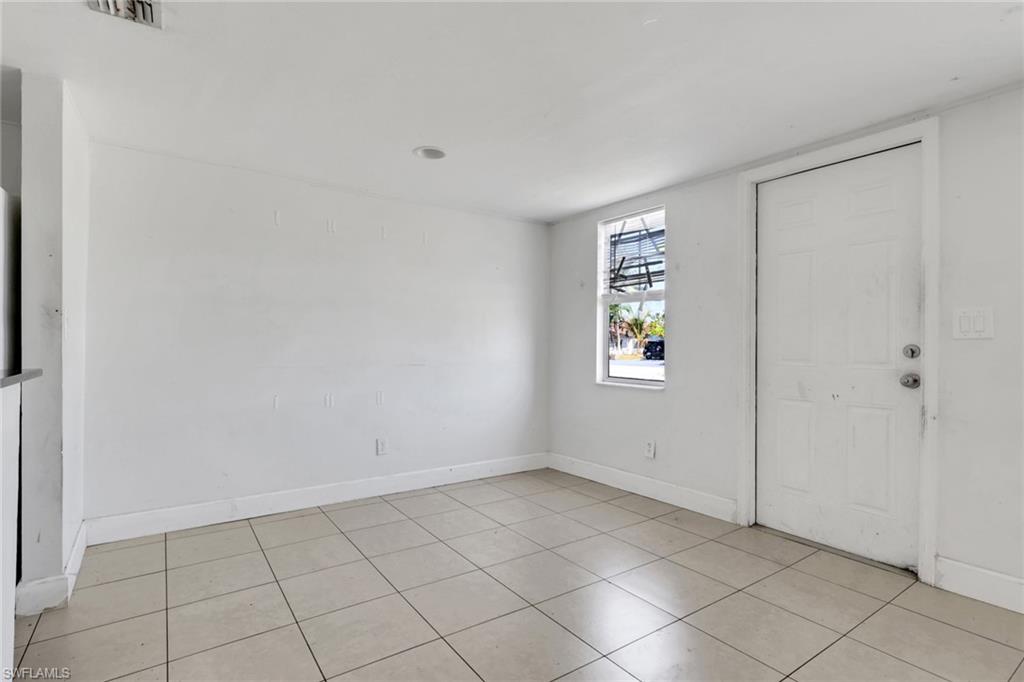 5326 Dixie Drive Naples, FL 34113 - Photo 2 of 25 an empty room with windows