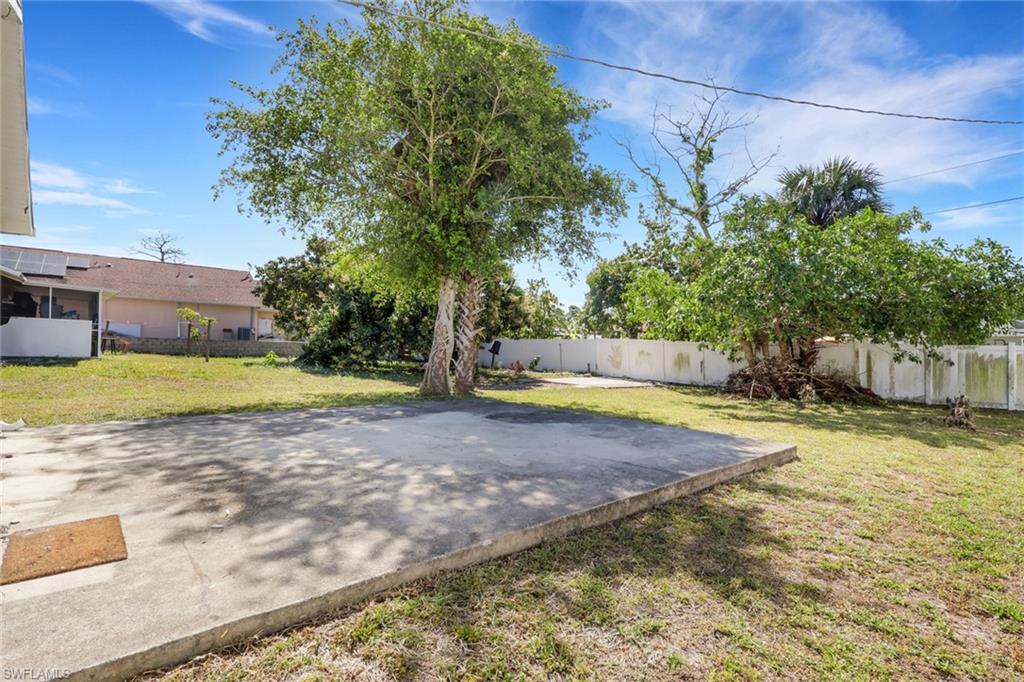 5326 Dixie Drive Naples, FL 34113 - Photo 25 of 25 a view of a swimming pool with a yard