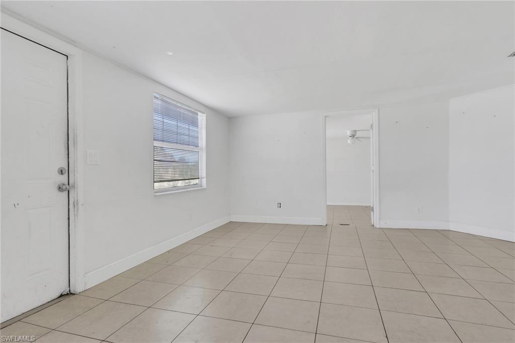 5326 Dixie Drive Naples, FL 34113 - Photo 8 of 25 a view of an empty room with window