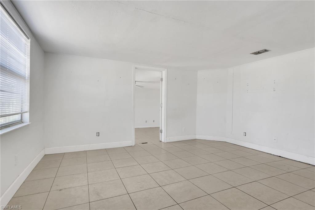 5326 Dixie Drive Naples, FL 34113 - Photo 9 of 25 a view of an empty room and window