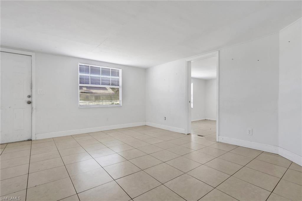 5326 Dixie Drive Naples, FL 34113 - Photo 10 of 25 an empty room with windows