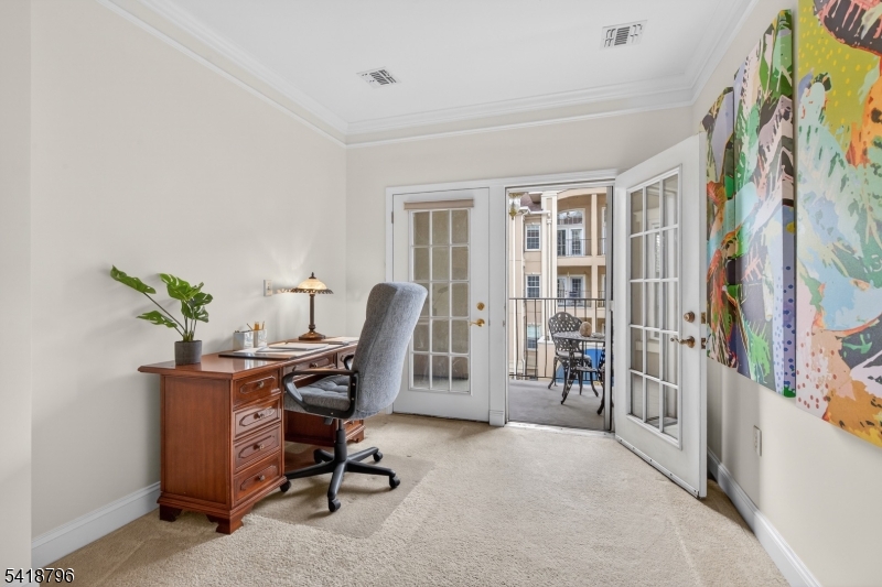 9210 Ravenscroft Road Clifton, NJ 07013 - Photo 11 of 18 a view of a workspace with furniture and a window