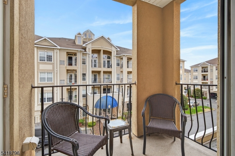 9210 Ravenscroft Road Clifton, NJ 07013 - Photo 12 of 18 a view of a chair and table in the balcony