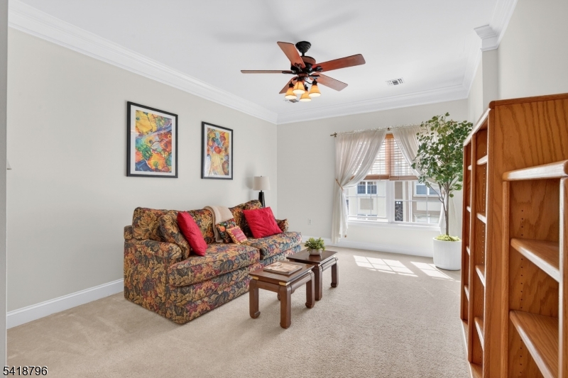 9210 Ravenscroft Road Clifton, NJ 07013 - Photo 16 of 18 a living room with furniture and a window