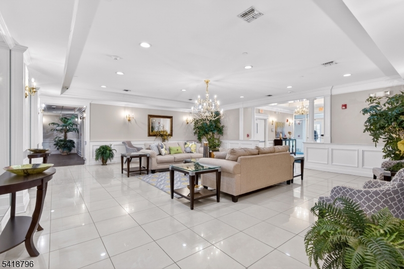 9210 Ravenscroft Road Clifton, NJ 07013 - Photo 2 of 18 a living room with furniture and a large window