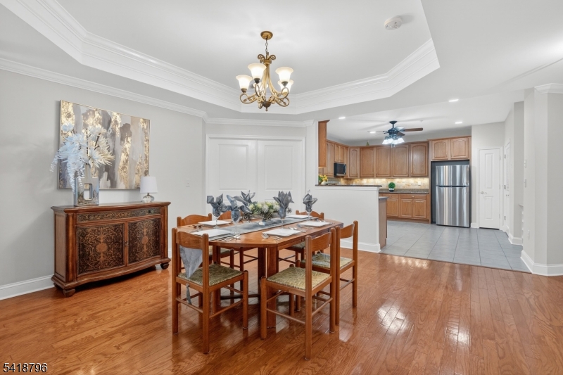9210 Ravenscroft Road Clifton, NJ 07013 - Photo 5 of 18 a view of a dining room with furniture wooden floor and chandelier