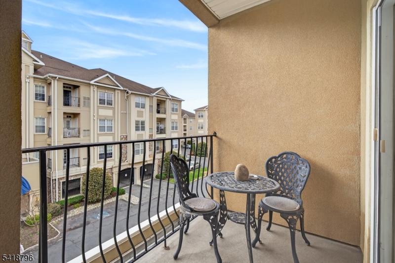 9210 Ravenscroft Road Clifton, NJ 07013 - Photo 7 of 18 a view of a chair and table in the balcony