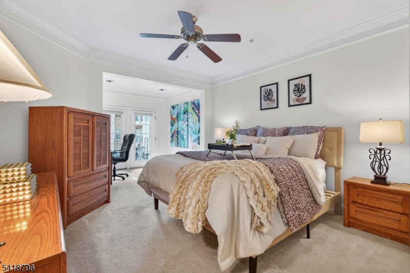 9210 Ravenscroft Road Clifton, NJ 07013 - Photo 9 of 18 a spacious bedroom with a bed and ceiling fan