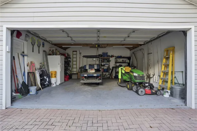 a view of a garage with parked cars