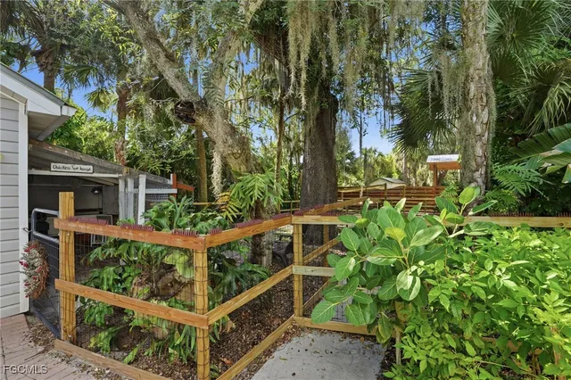 front view of a house with large trees