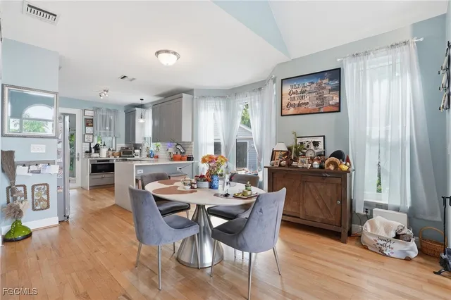 a view of a dining room with furniture window and wooden floor